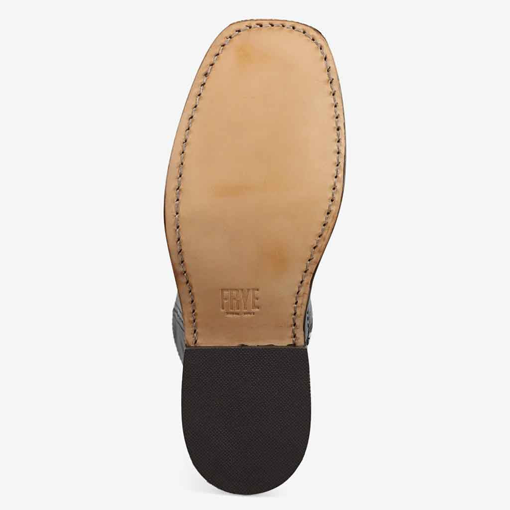 Close-up of a leather shoe sole with 'Ryve' branding on a white background