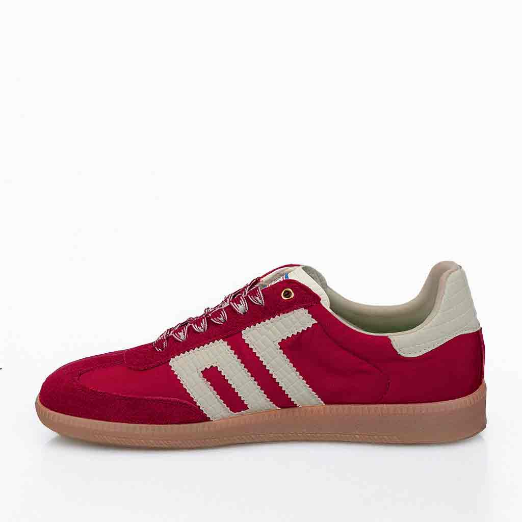 Red sneaker with white accents on a white background